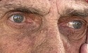 Elderly person with wrinkles around their eyes