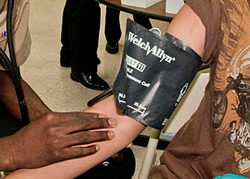 A person's blood pressure measurements being taken