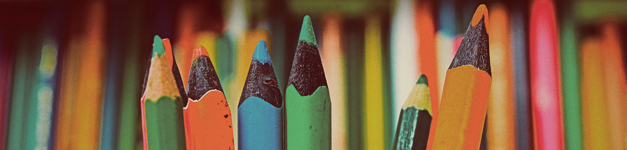 Decorative banner image of colored pencils.